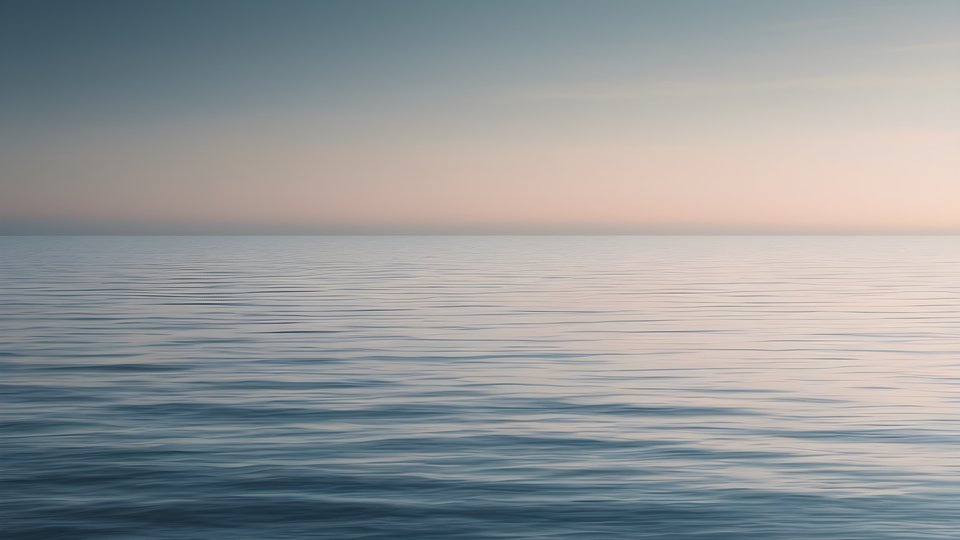 A thin horizon line over a gradient sea with vast negative space