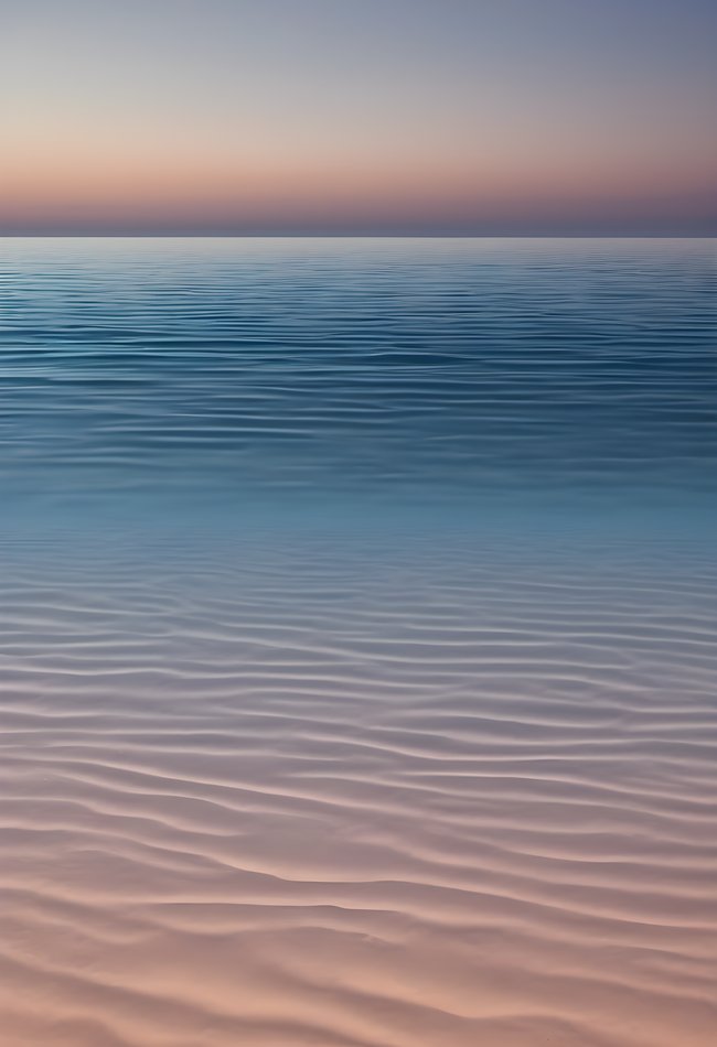 A thin horizon line over a gradient sea