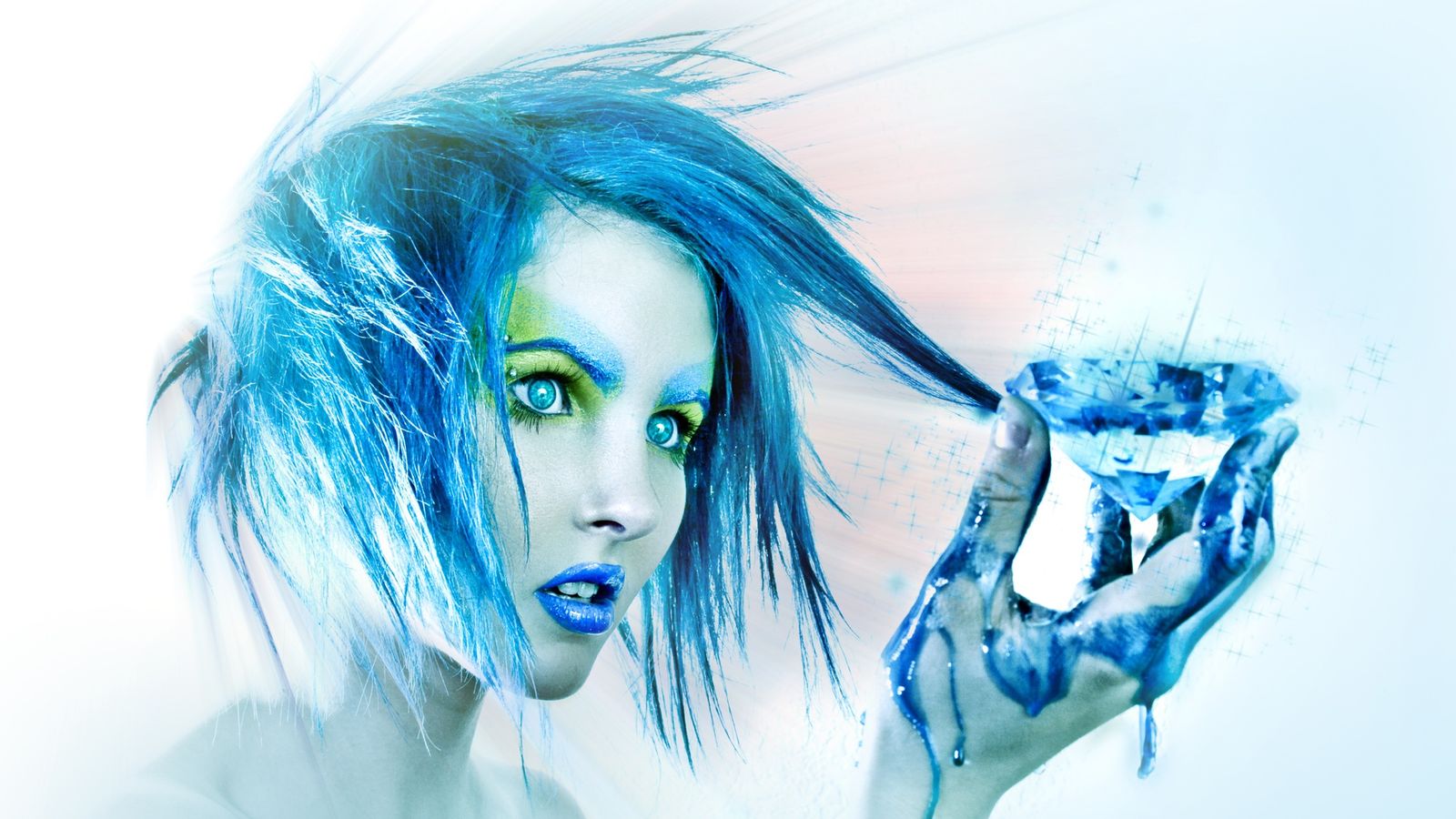 A woman with vivid blue hair and makeup holding a glowing blue diamond in a painted hand.